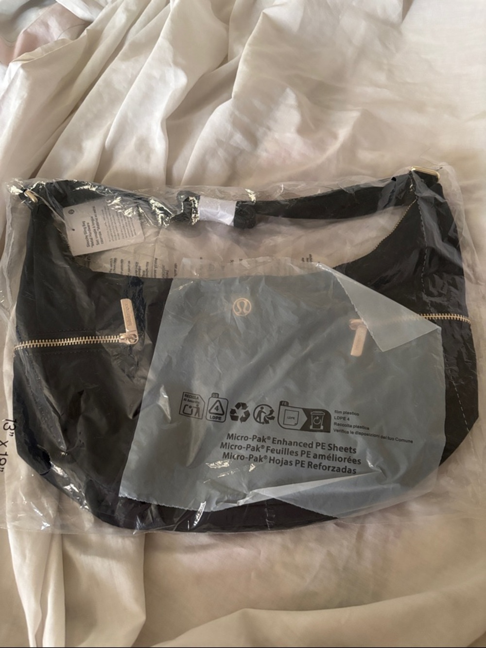 lululemon athletica Black slouchy sling bag with Gold Zippers